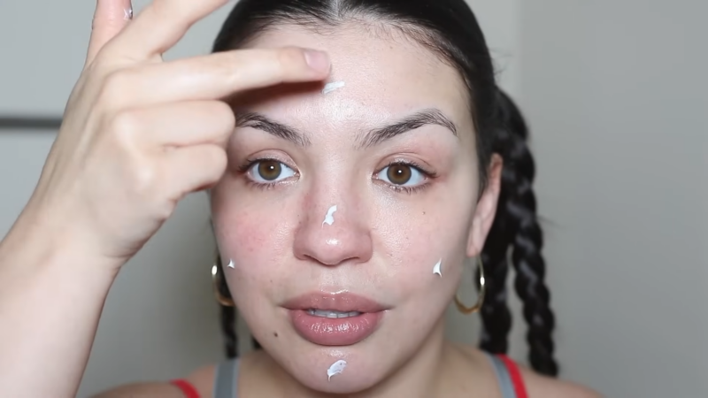 Woman Applying Tretinoin Cream to Her Face