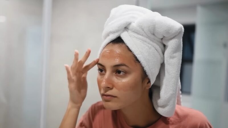 A Woman Applying Lactic Acid to Her Face 