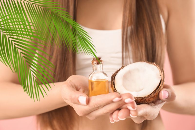 A woman holding coconut oil